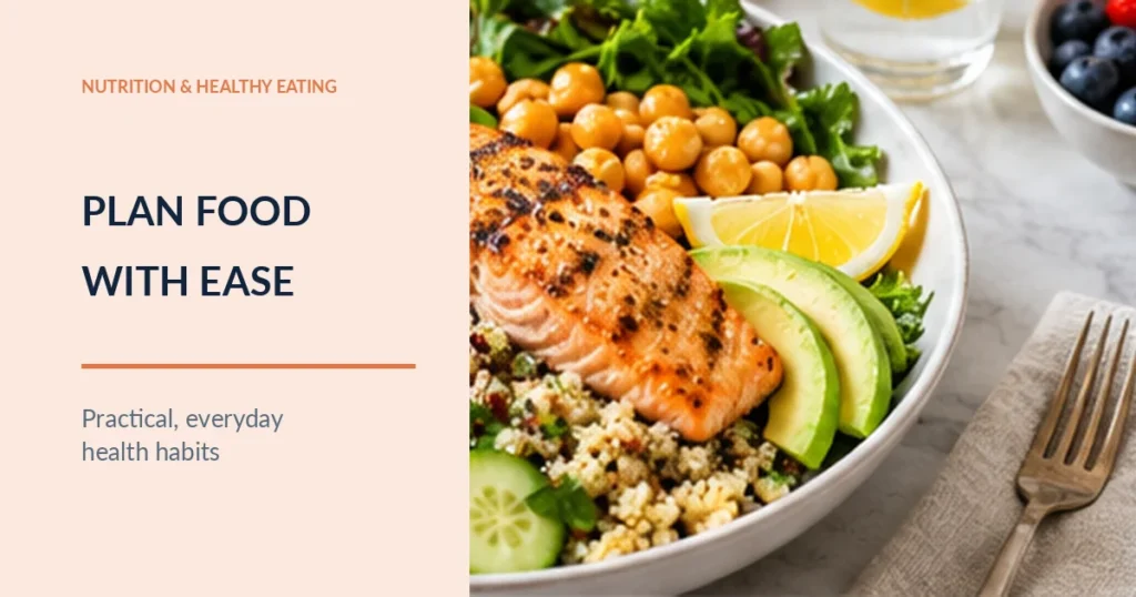 Bowl of salmon, grains, vegetables, chickpeas and avocado on a table